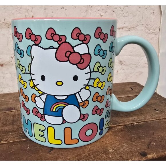 Hello Kitty Ceramic Mug Multi-Colored Bow Print Pastel Blue Pink Interior - Picture 1 of 7